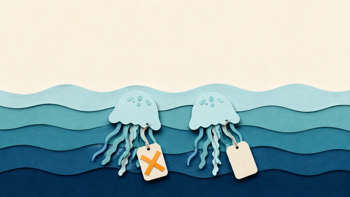 Illustrazione papercut di due meduse quasi identiche affiancate, ciascuna con un cartellino di carta, quello di sinistra sbarrato da una croce arancione