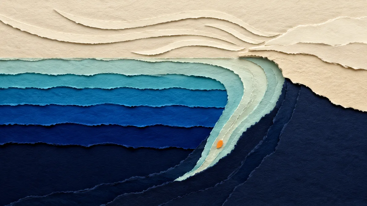 Illustrazione papercut di vento che soffia verso una costa e spinge l'acqua superficiale verso il basso lungo la scarpata